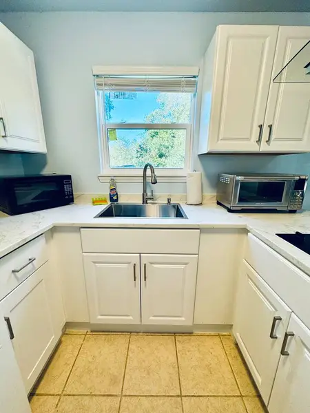 Kitchen counter with a sink under the window