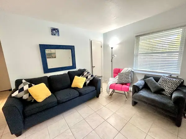 Living room with a sofa and armchair