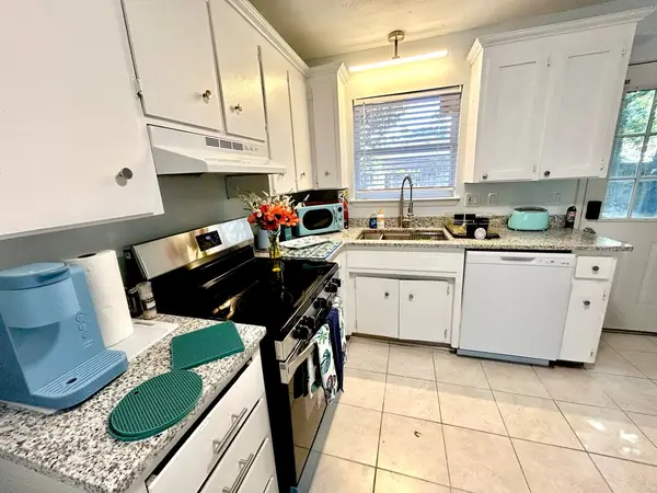 Kitchen with an electric stove and dishwasher