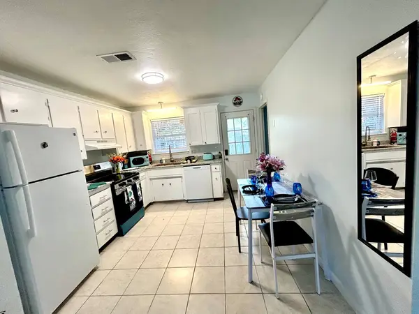 Kitchen with a fridge and plenty of counter space