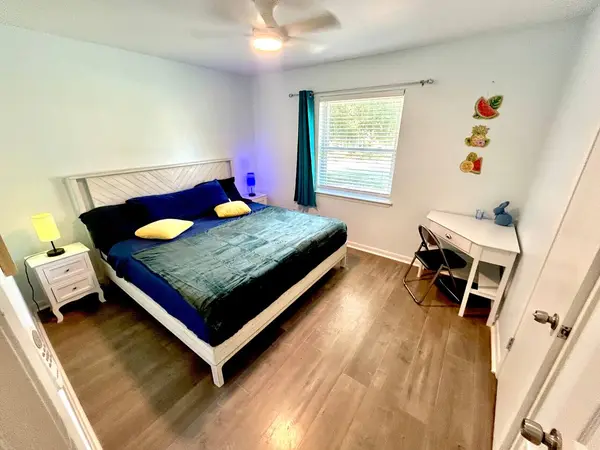 Bedroom with a king bed and a desk