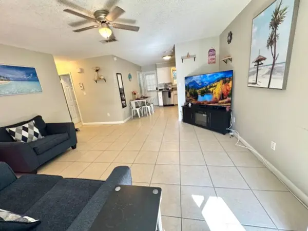 Open-plan living area with a large TV