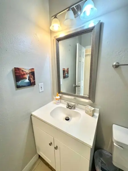 Bathroom vanity with a large mirror